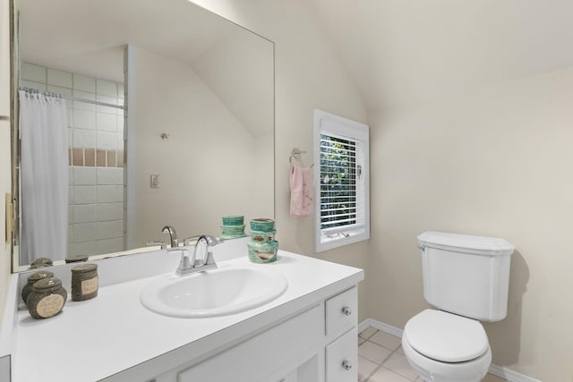 full bath with tile patterned flooring, toilet, vanity, baseboards, and vaulted ceiling