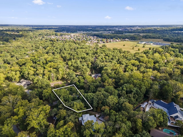 bird's eye view with a view of trees