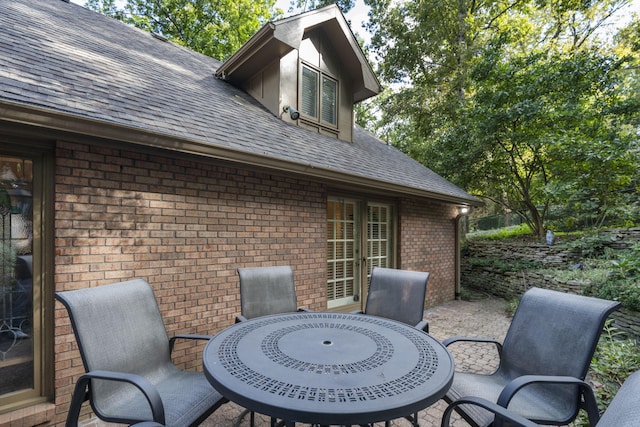 exterior space with outdoor dining space and a patio area