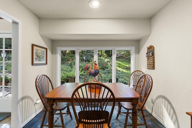 dining space with plenty of natural light and baseboards