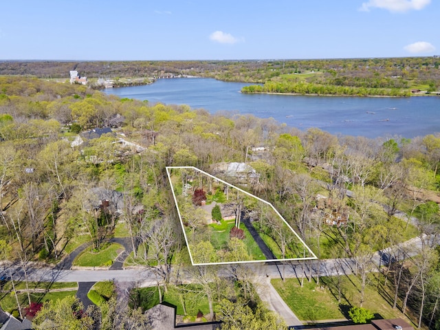 aerial view with a view of trees and a water view