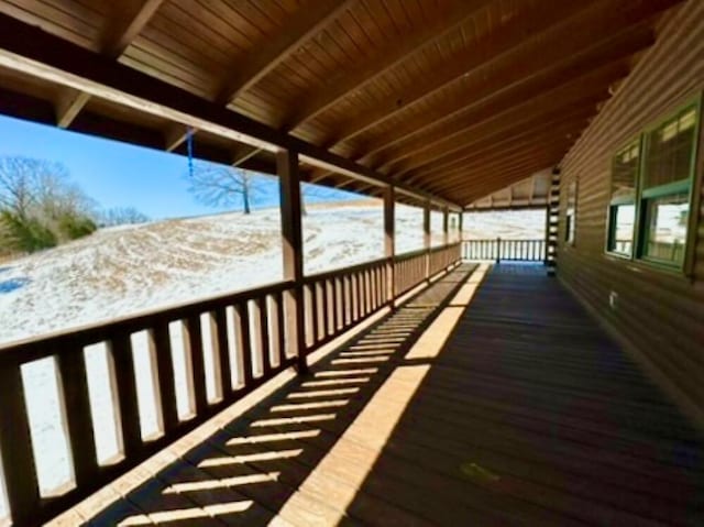 view of snow covered deck