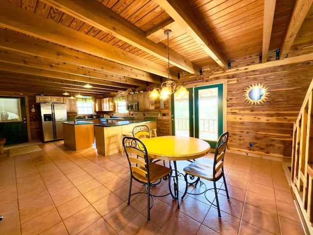 unfurnished dining area with light tile patterned floors, wooden walls, wooden ceiling, beam ceiling, and a notable chandelier