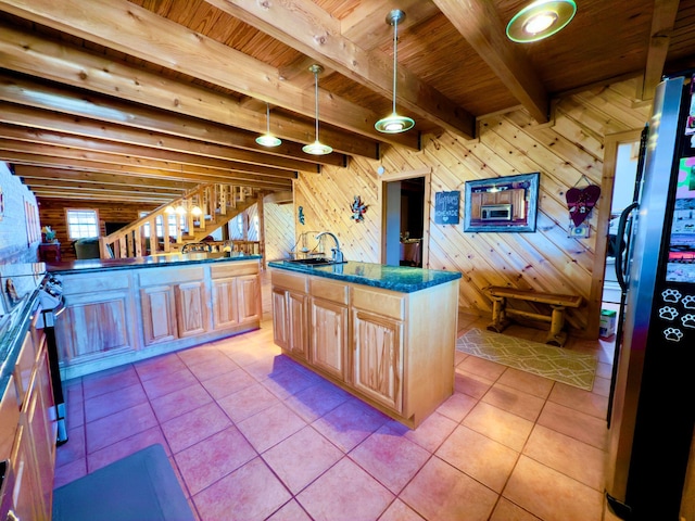 kitchen featuring wooden ceiling, freestanding refrigerator, pendant lighting, beam ceiling, and light tile patterned flooring