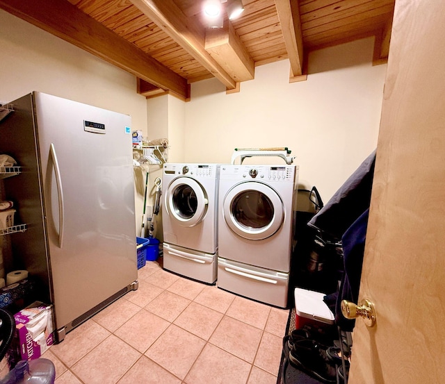 laundry room featuring light tile patterned floors, laundry area, independent washer and dryer, and wood ceiling