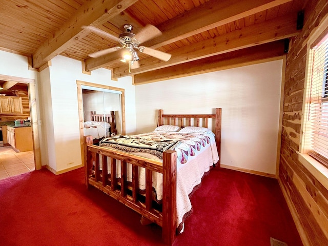 carpeted bedroom with wood ceiling, multiple windows, and beam ceiling