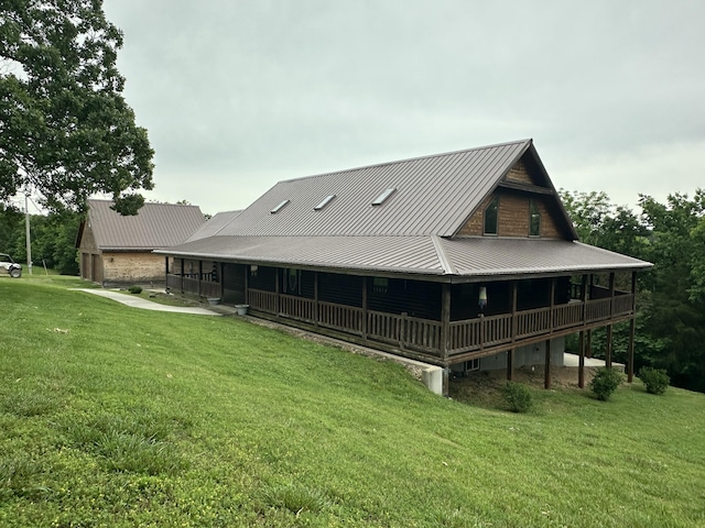 300 Roundup Ln, Bakersfield, MO 65609 - rear view of house with a yard, metal roof, and a deck