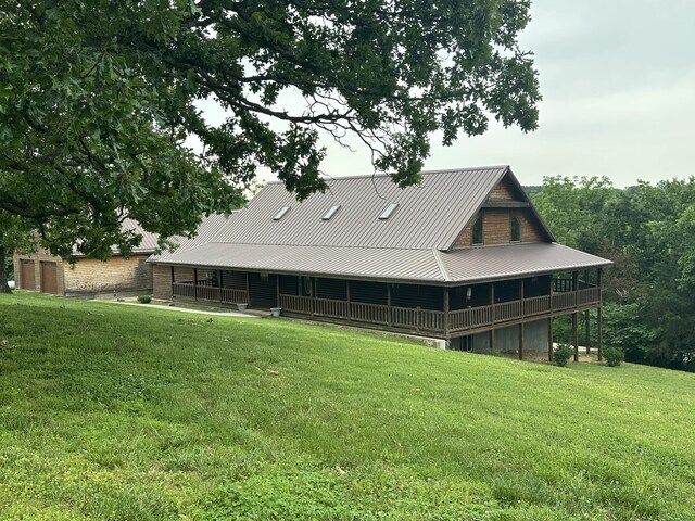 300 Roundup Ln, Bakersfield, MO 65609 - rear view of house with a lawn and metal roof