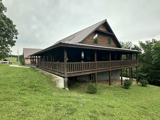 300 Roundup Ln, Bakersfield, MO 65609 - view of home's exterior with a yard, metal roof, and a wooden deck