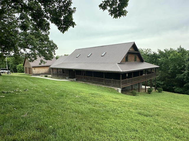 300 Roundup Ln, Bakersfield, MO 65609 - rear view of house featuring a lawn and metal roof