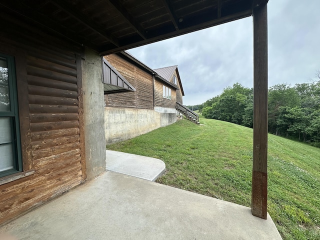 300 Roundup Ln, Bakersfield, MO 65609 - view of green lawn featuring a patio