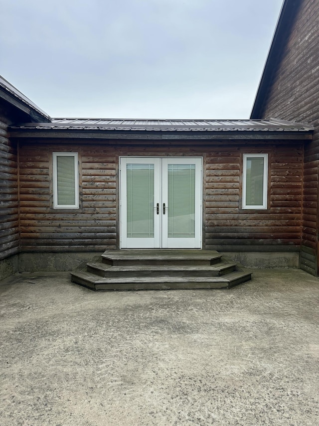 300 Roundup Ln, Bakersfield, MO 65609 - back of property featuring french doors, metal roof, and faux log siding