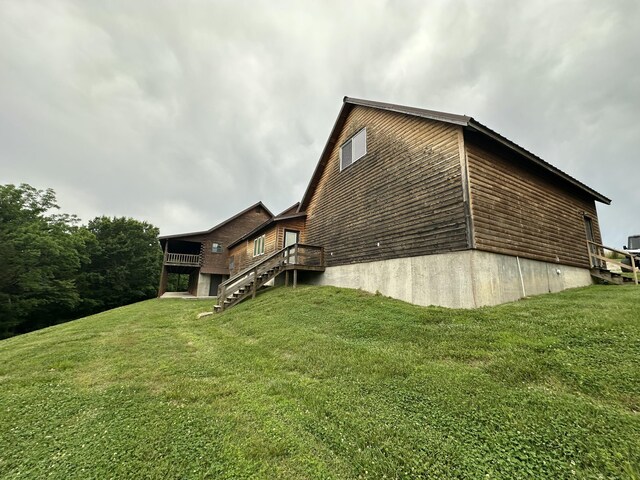 300 Roundup Ln, Bakersfield, MO 65609 - view of side of property with stairs, a yard, and a wooden deck