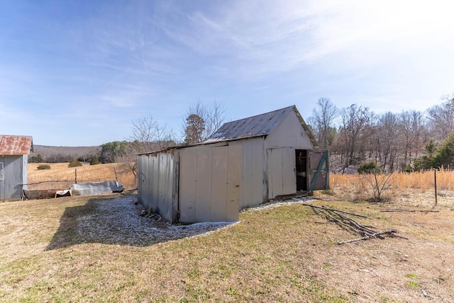 view of outbuilding featuring an outdoor structure