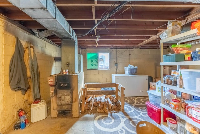 unfinished basement with fridge