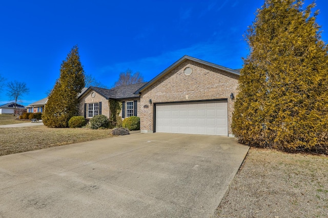 ranch-style house featuring driveway, a garage, and brick siding