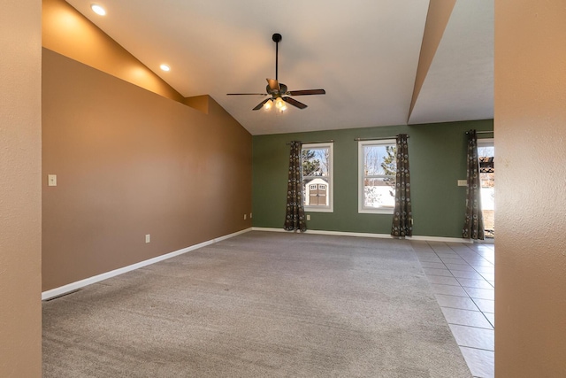 carpeted spare room featuring lofted ceiling, tile patterned flooring, recessed lighting, a ceiling fan, and baseboards