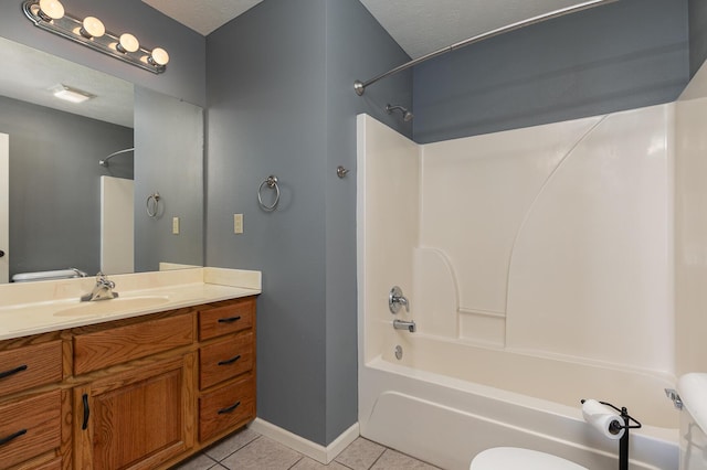 bathroom featuring toilet, tile patterned flooring, washtub / shower combination, and a textured ceiling