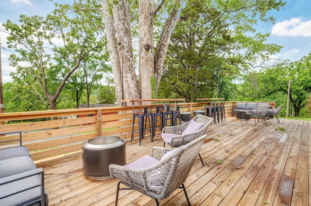 wooden deck featuring outdoor lounge area