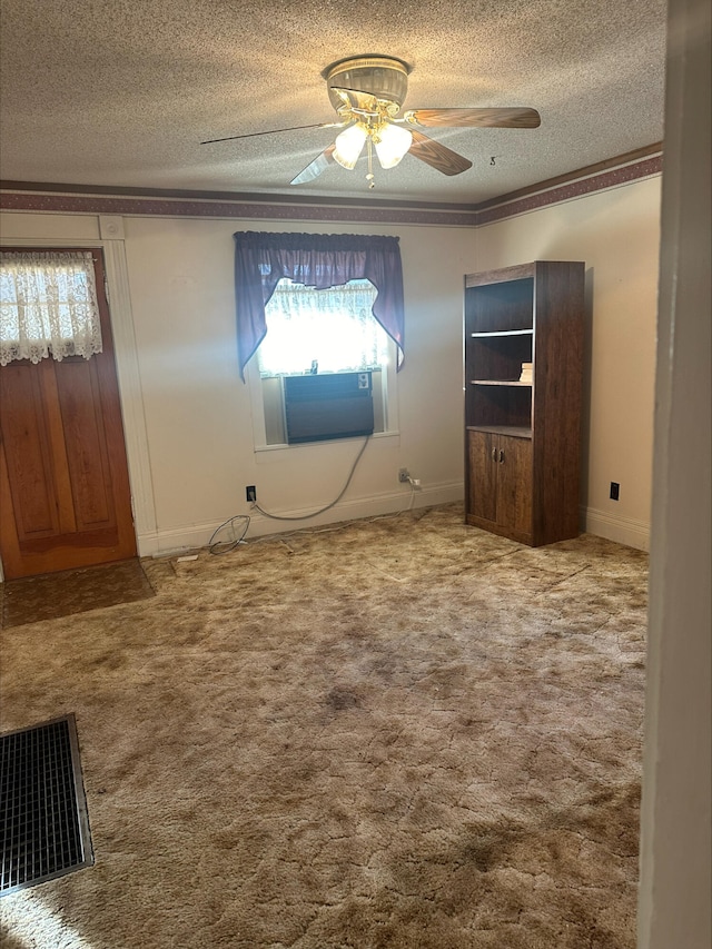 unfurnished bedroom featuring carpet, visible vents, and a textured ceiling