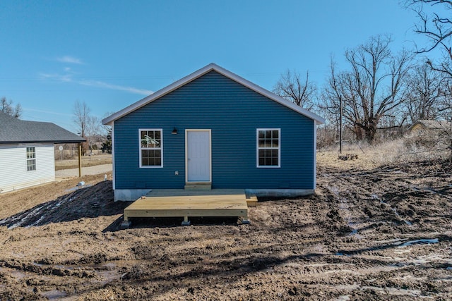 back of property with a deck