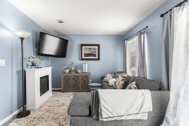 187 Clubhouse Dr Unit 19, Branson, MO 65616 - living area featuring a fireplace, visible vents, and baseboards