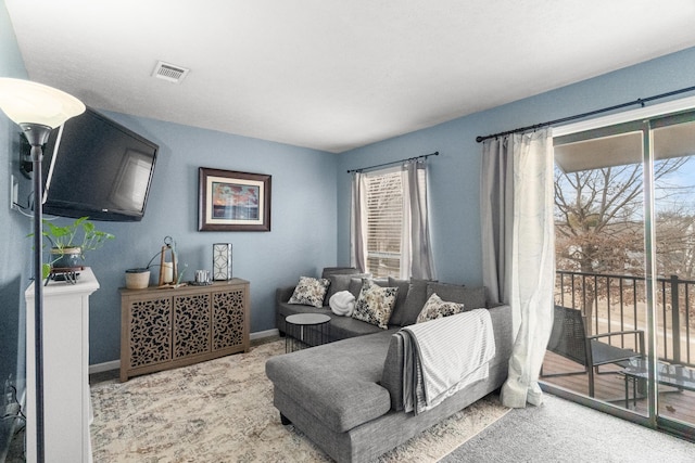 187 Clubhouse Dr Unit 19, Branson, MO 65616 - living room featuring light carpet, baseboards, and visible vents