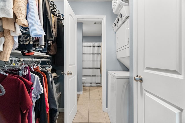 187 Clubhouse Dr Unit 19, Branson, MO 65616 - spacious closet with visible vents, stacked washing maching and dryer, and light tile patterned floors