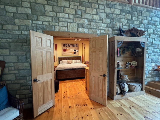 bedroom with hardwood / wood-style flooring