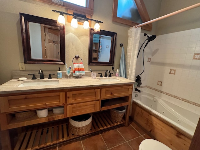 full bathroom with a combined bath / shower with jetted tub, double vanity, a sink, and tile patterned floors