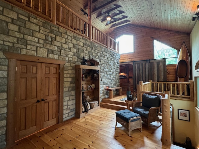 interior space featuring high vaulted ceiling, wooden ceiling, and light wood finished floors