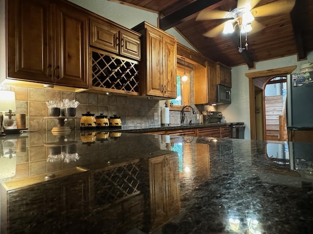 kitchen featuring lofted ceiling with beams, black / electric stove, wooden ceiling, a sink, and tasteful backsplash