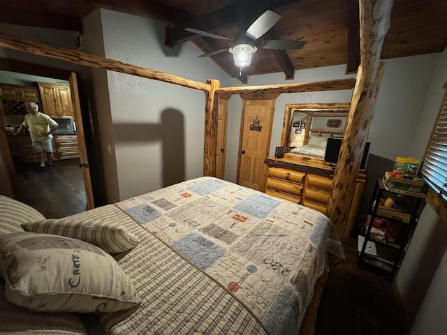 bedroom with lofted ceiling with beams