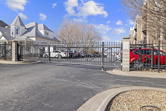 view of gate featuring fence