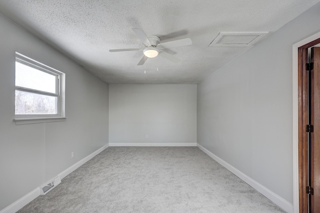 503 Chestnut St, Neosho, MO 64850 - spare room featuring attic access, visible vents, a textured ceiling, and baseboards