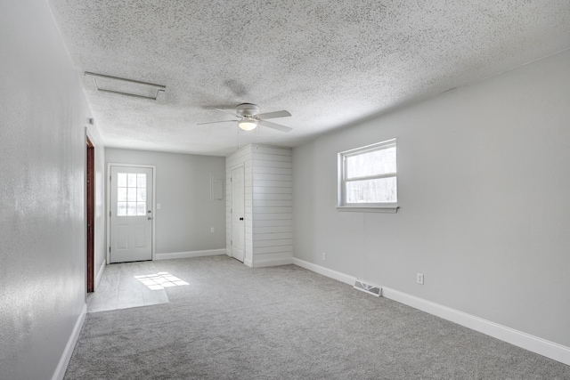 503 Chestnut St, Neosho, MO 64850 - empty room featuring light carpet, a healthy amount of sunlight, baseboards, and visible vents