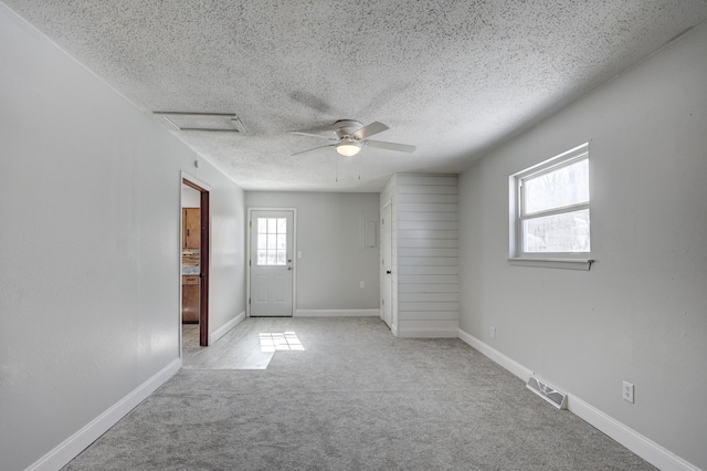 503 Chestnut St, Neosho, MO 64850 - unfurnished room with attic access, baseboards, visible vents, light colored carpet, and a textured ceiling