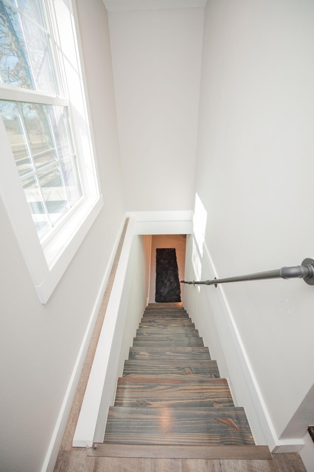 stairway featuring baseboards