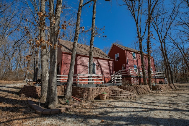 view of property exterior with stairway