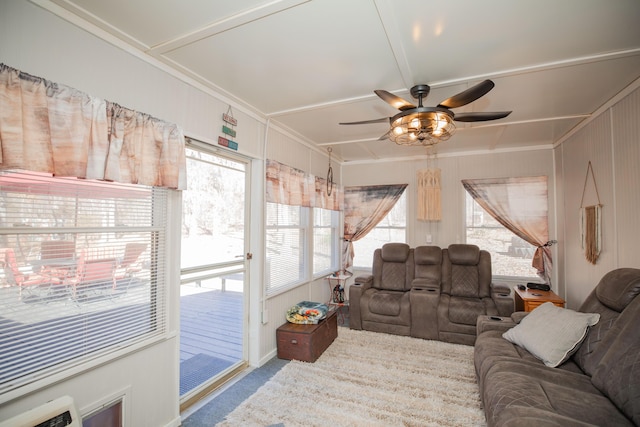 living area featuring a ceiling fan and light colored carpet