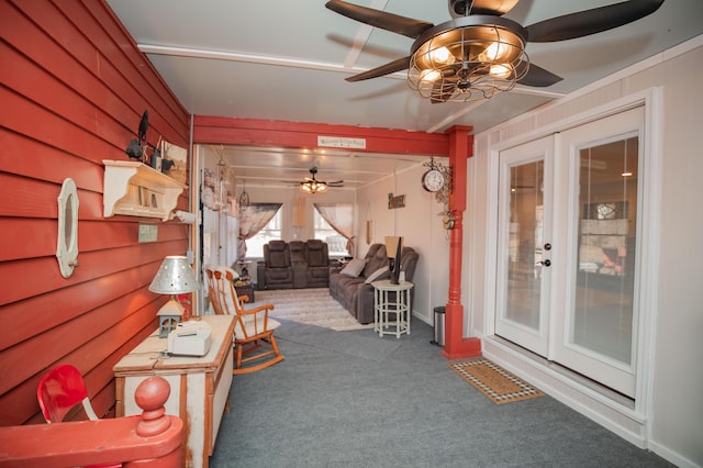 interior space with french doors and ceiling fan