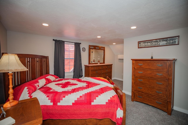 carpeted bedroom with recessed lighting, a wall mounted air conditioner, a textured ceiling, and baseboards