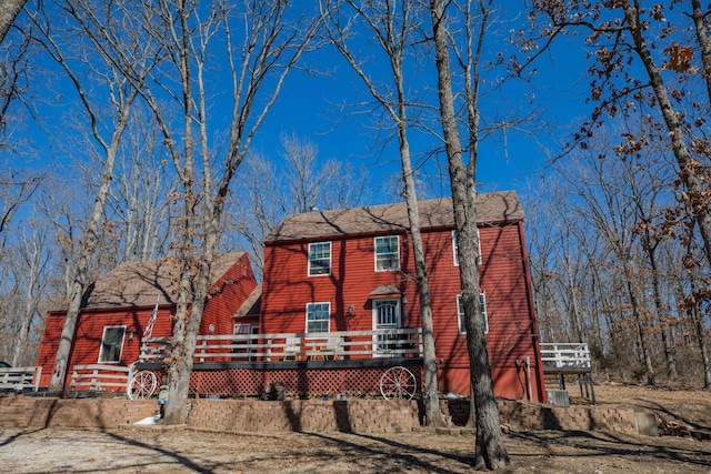 view of front facade with a wooden deck