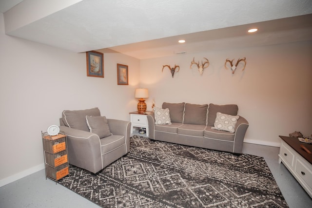 living area with recessed lighting and baseboards