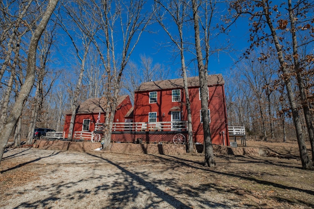 view of front of property with a wooden deck