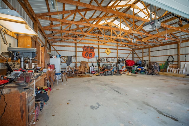 garage featuring metal wall and a garage door opener