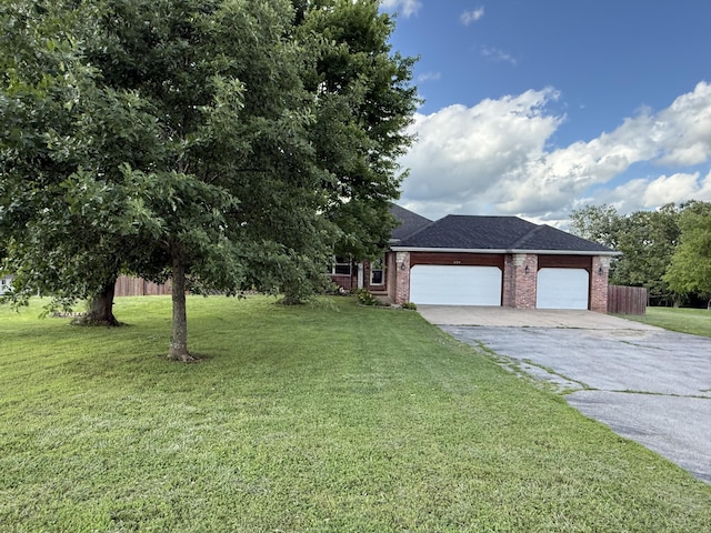 219 E Creekview Rd, Clever, MO 65631 - view of front of home featuring driveway, brick siding, a garage, and a shingled roof