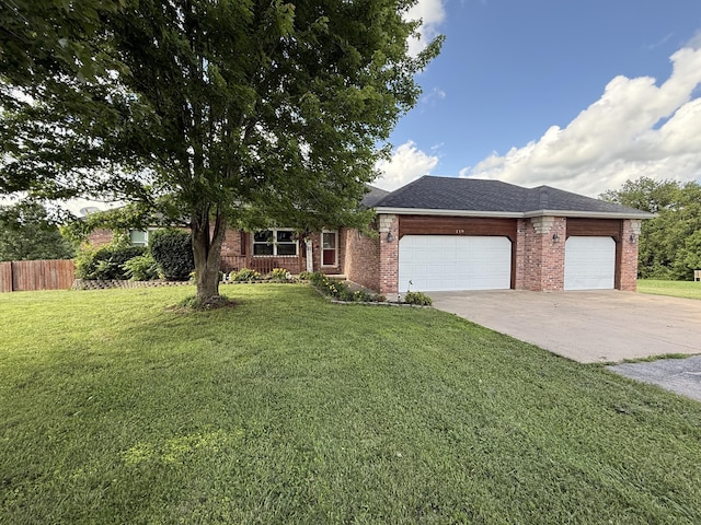 219 E Creekview Rd, Clever, MO 65631 - view of front of house featuring concrete driveway, an attached garage, and brick siding
