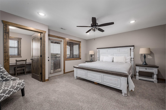 bedroom with visible vents, light carpet, baseboards, and access to exterior