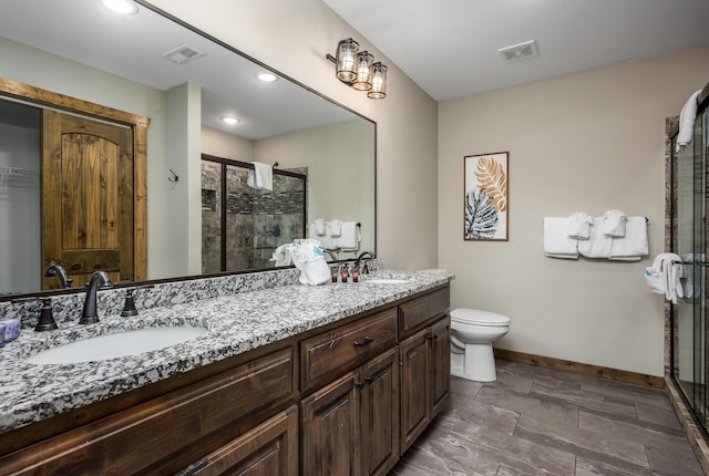 bathroom with a shower stall, visible vents, and a sink